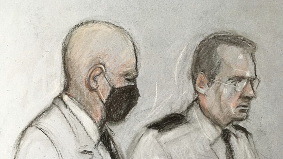 This court artist sketch by Elizabeth Cook shows former police officer Wayne Couzens at the Old Bailey in London, Thursday, Sept. 30, 2021. A serving London police officer has been sentenced to life i ...