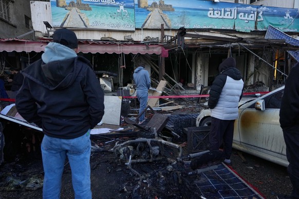 People check a destroyed coffeeshop at the site of an Israeli strike in the southern port city of Sidon, Lebanon, Wednesday, April, 8, 2026. (AP Photo/Mohammed Zaatari)
Lebanon Israel Iran War