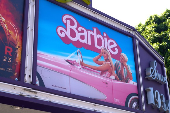 epa10791303 A sign advertises the movie ?Barbie? at the Los Feliz theater in Los Angeles, California, USA, 08 August 2023. Greta Gerwig became the first solo female filmmaker with a billion-dollar fil ...