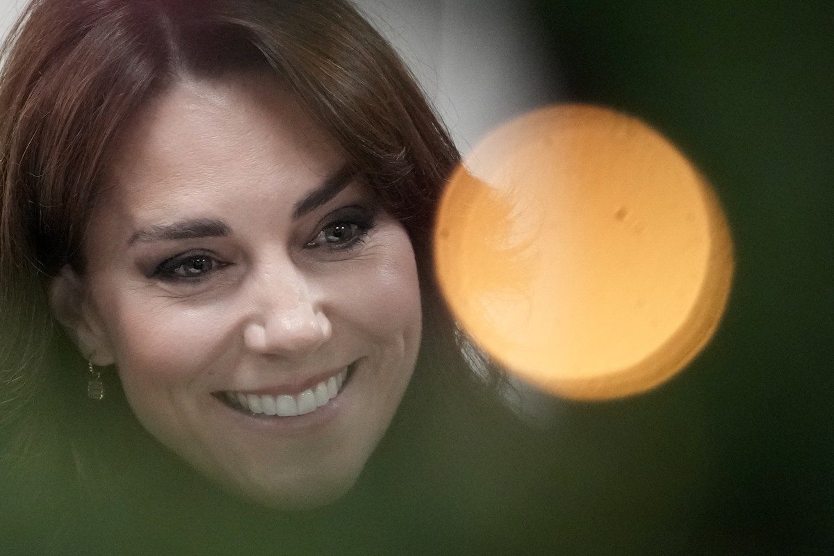 FILE - Kate, Princess of Wales, is seen behind a Christmas tree decorations as talks to people during her visit to Sebby's Corner in north London, Friday, Nov. 24, 2023. Kate, Princess of Wales,  ...