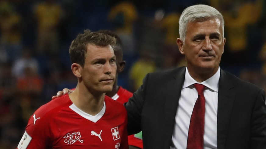 Switzerland head coach Vladimir Petkovic, right, and Switzerland&#039;s Stephan Lichtsteiner, left, at the end of the match during the group E match between Brazil and Switzerland at the 2018 soccer W ...