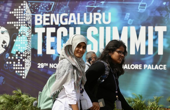 epa11001027 People walk to attend the 25th edition of &#039;Bengaluru Tech Summit-2023 in Bangalore, India, 29 November 2023. Asia?s largest Tech show with over 600 exhibitors and 4,000 delegates from ...