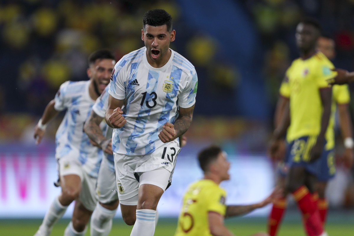 Argentina's Cristian Romero celebrates scoring his side's first goal against Colombia during a qualifying soccer match for the FIFA World Cup Qatar 2022 at the Metropolitano stadium in Barra ...