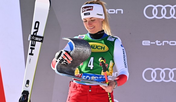 epa09541122 Second placed Lara Gut-Behrami of Switzerland celebrates on the podium after the women?s giant slalom at the FIS Alpine Ski World Cup season opening in Soelden, Austria, 23 October 2021. E ...