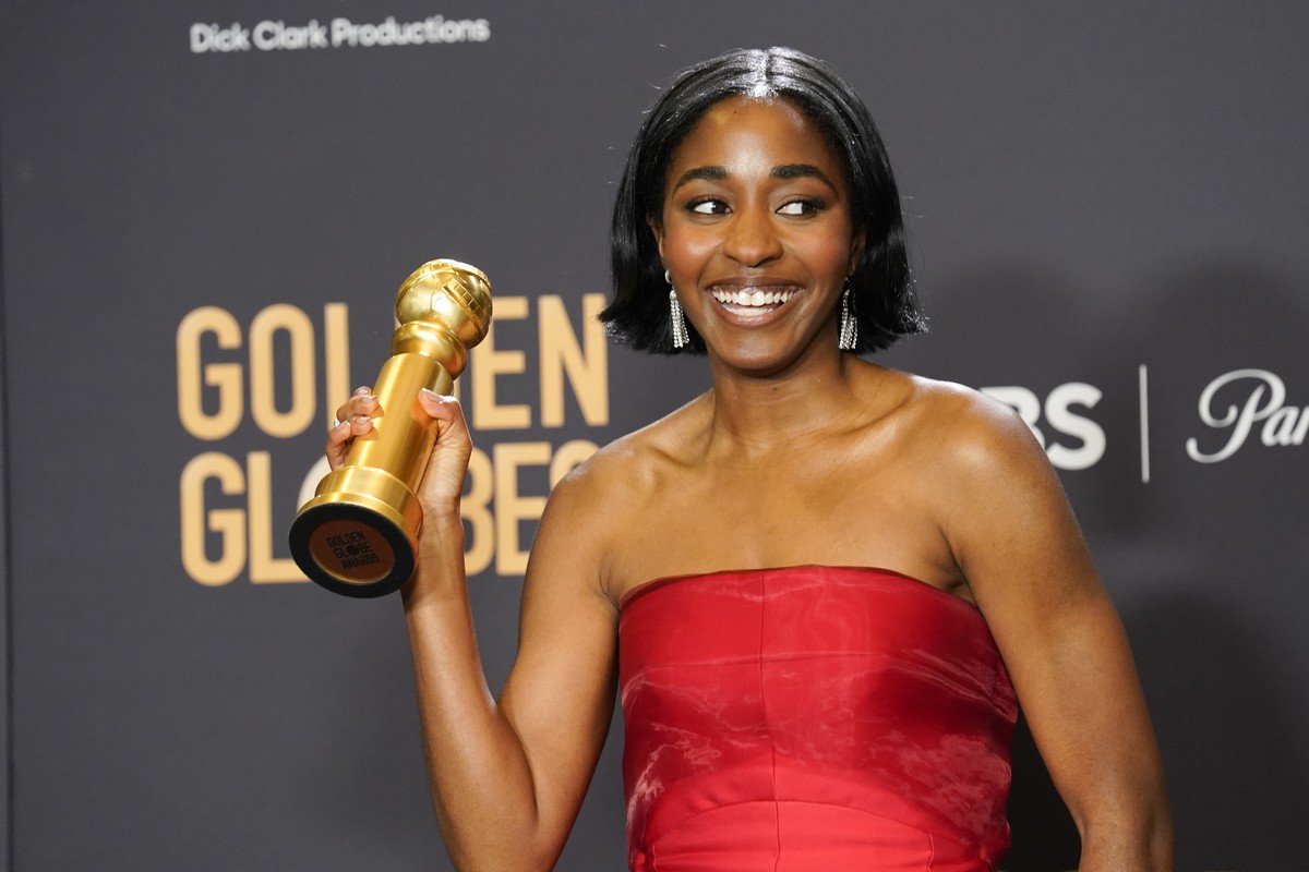 Ayo Edebiri poses in the press room with the award for best performance by an actress in a television series, musical or comedy for "The Bear" at the 81st Golden Globe Awards on Sunday, Jan. ...
