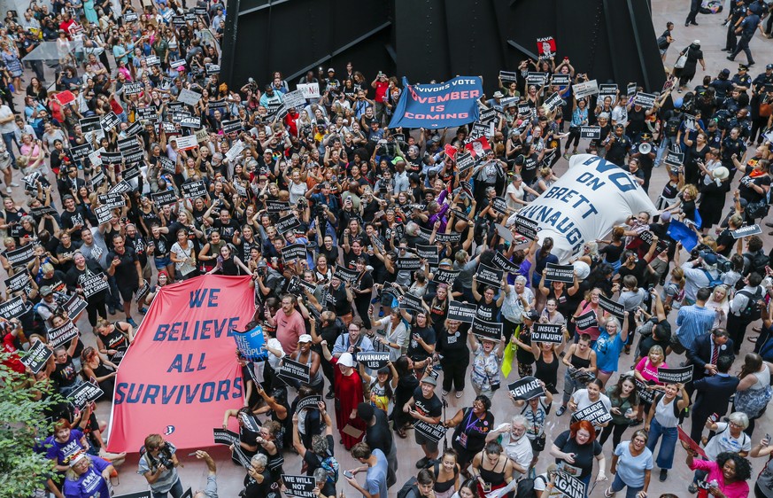 epa07070214 Protestors against the confirmation of Supreme Court nominee Judge Brett Kavanaugh demonstrate in the atrium of the Hart Senate Office Building in Washington, DC, USA, 04 October 2018. EPA ...