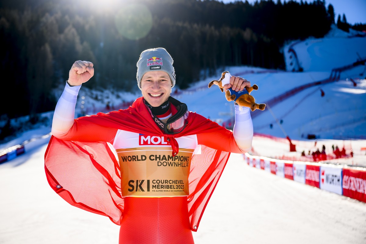 Gold medalist Marco Odermatt of Switzerland poses after the podium ceremony of the men's downhill race at the 2023 FIS Alpine Skiing World Championships in Courchevel/Meribel, France, Sunday, Feb ...