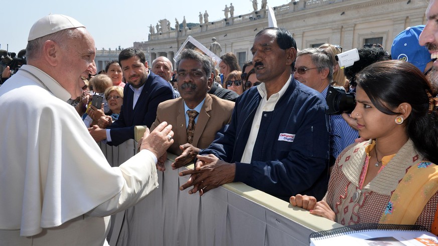 Pope Francis meets the husband of a Pakistani Christian woman, Asia Bibi, who was convicted of blasphemy by a Pakistani court, Ashiq Masiq and her daughter Eisham, right, at the end of his weekly gene ...