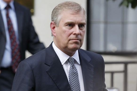 FILE- In this June 6, 2012 file photo, Britain's Prince Andrew leaves King Edward VII hospital in London after visiting his father Prince Philip. Prince Andrew says in a BBC interview scheduled to be  ...