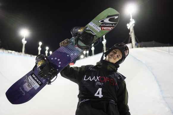 epa09687979 Jan Scherrer of Switzerland celebrates after taking the second place in the final run of the halfpipe competition at the FIS Snowboard World Cup Laax Open in Laax, Switzerland, 15 January  ...