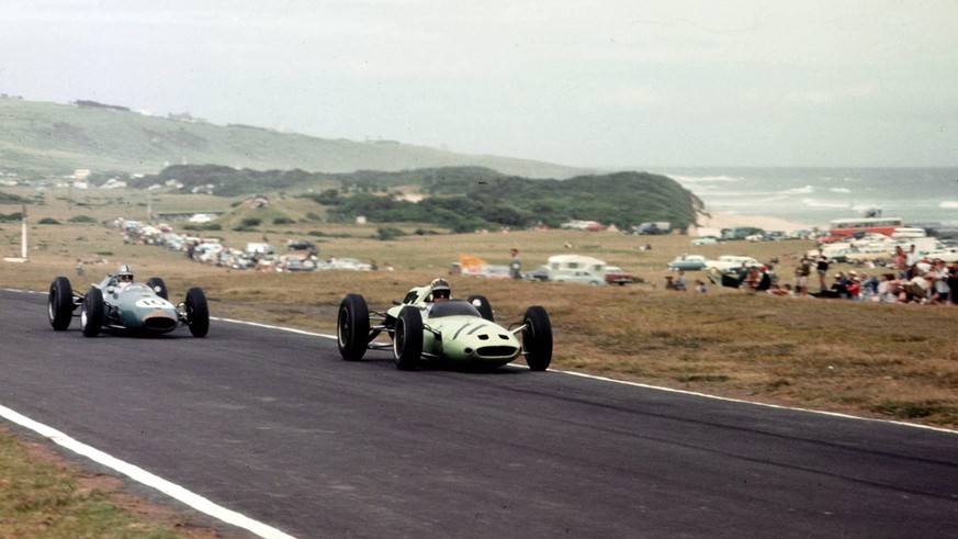 1962 South African Grand Prix. East London, South Africa. 27-29 December 1962. Innes Ireland (Lotus 24 Climax) leads Jack Brabham (Brabham BT3 Climax) and Trevor Taylor (Lotus 25 Climax). Brabham and  ...