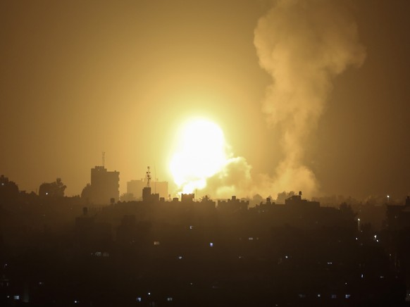 An explosion is caused by Israeli airstrikes on a Hamas military base in town of Khan Younis, southern Gaza Strip, Tuesday, April 19, 2022. (AP Photo/Yousef Masoud)
