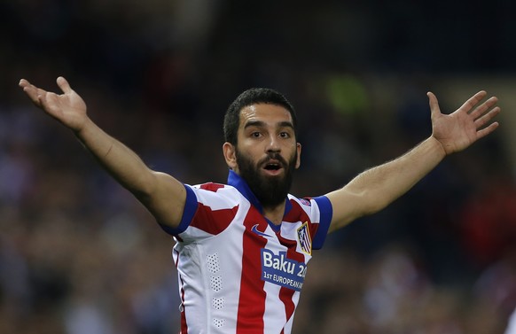 Atletico&#039;s Arda Turan reacts during the Champions League quarterfinal first leg soccer match between Atletico Madrid and Real Madrid at the Vicente Calderon stadium in Madrid, Spain, Tuesday, Apr ...