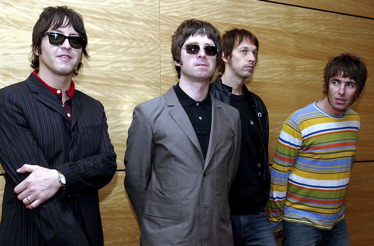 FILE - Members of British rock band Oasis pose for photos ahead of a concert in Hong Kong, Feb. 25, 2006. From left are, Gem Archer, Noel Gallagher, Andy Bell, and Liam Gallagher. (AP Photo/Lo Sai Hun ...