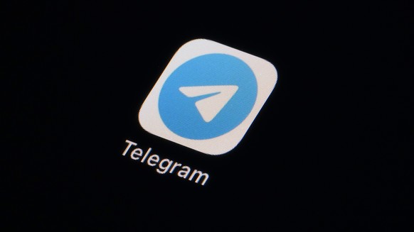 FILE - The icon for the instant messaging Telegram app is seen on a smartphone, Tuesday, Feb. 28, 2023, in Marple Township, Pa. A federal judge in Brazil on Wednesday, April 26, ordered a temporary su ...