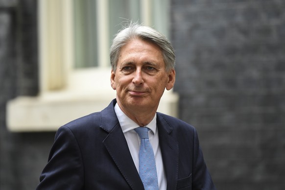 Conservative Party lawmaker and former Chancellor, Philip Hammond, leaves Downing Street in London, Tuesday, Sept. 3, 2019. (AP Photo/Alberto Pezzali)