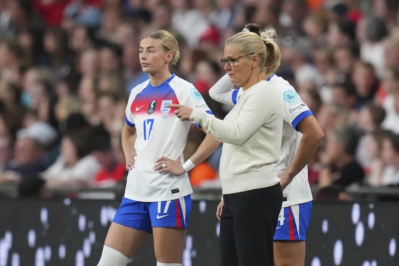 FILE - England coach Sarina Wiegman gestures next to England&#039;s Chloe Kelly during the women&#039;s Nations League soccer match between England and Portugal at the Wembley Stadium, in London, Frid ...