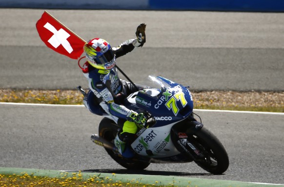Moto 2 rider Dominique Aegerter of Switzerland waves after finishing in second position at the Spain&#039;s Motorcycle Grand Prix at the Jerez race track on Sunday, May 4, 2014 in Jerez de la Frontera ...