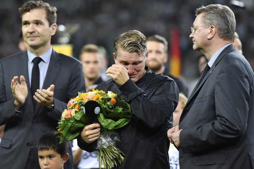 Germany&#039;s Bastian Schweinsteiger hides tears during a farewell ceremony prior a friendly soccer match between Germany and Finland in Moenchengladbach, Germany, Wednesday, Aug. 31, 2016. The capta ...