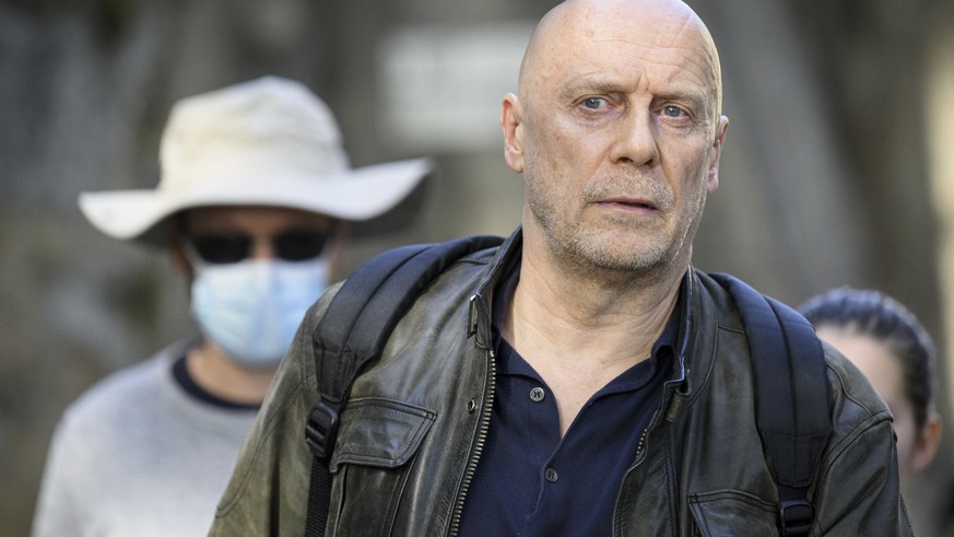 French-Swiss far-right writer Alain Soral, center, leaves the courthouse after his appeal trial for homophobia against a journalist in Lausanne, Switzerland, Wednesday, September 27, 2023. The court r ...