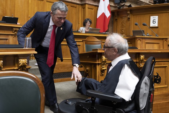 Federal Councilor Ignazio Cassis, left, talks with National Councilor Christian Lohr, Center TG, at the Spring Meeting of Federal Councils on Monday, March 6, 2023 in Bern.  (KEYSTONE/Peter Schneid ...
