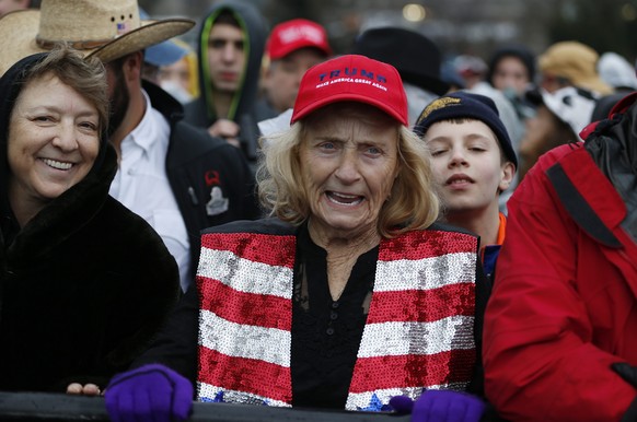 epa05734846 People on the National Mall a short time before Donald J. Trump is sworn in as the 45th President of the United States in Washington, DC, USA, 20 January 2017. Trump won the 08 November 20 ...