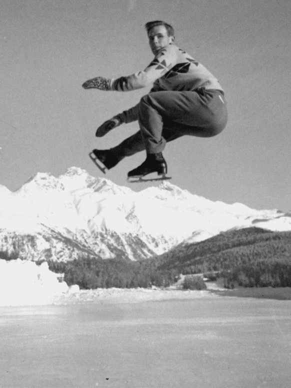 FILE - Dick Button of Englewood, N.J., U.S. and North American men's figure skating champion, and winner of the European title, executes a jump during a practice session at St. Moritz, Switzerlan ...