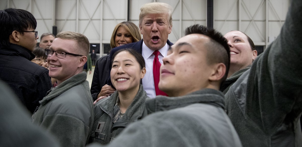 FILE - In this Thursday, Dec. 27, 2018 file photo, President Donald Trump, center, and first lady Melania Trump, center left, greet members of the military at Ramstein Air Base, Germany. Germany' ...