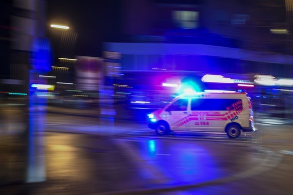 epa06587956 An ambulance with emergency lights switched on at the Praterstrasse in Vienna, Austria, 07 March 2018. According to local media reports, a family of three people have been seriously injure ...