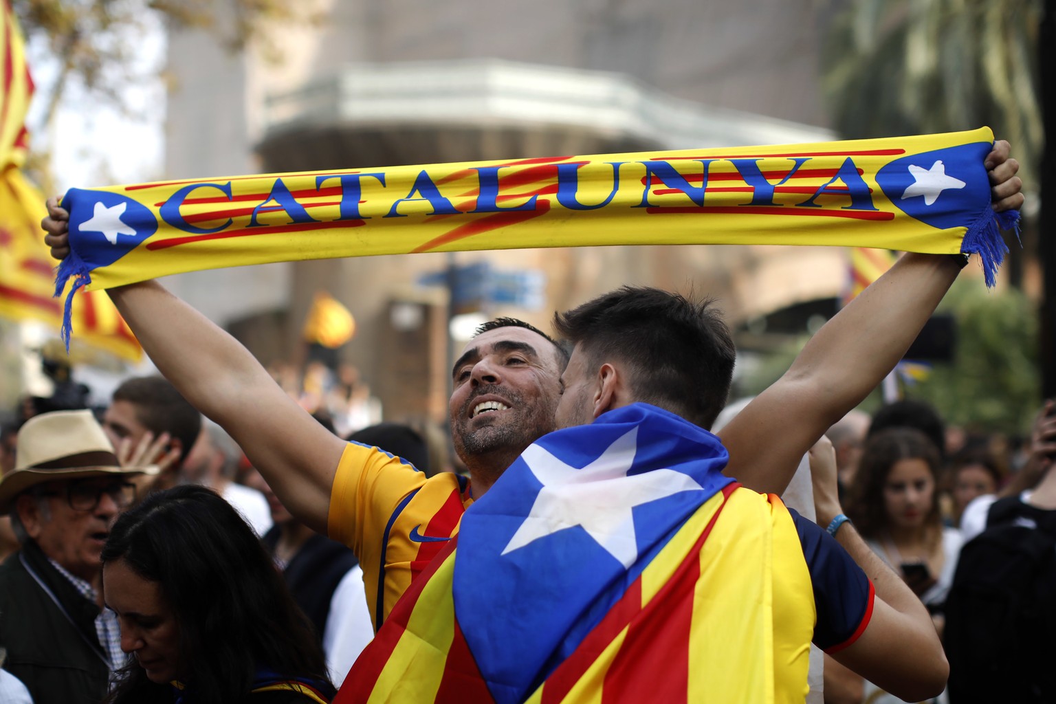 People react as they celebrate the unilateral declaration of independence of Catalonia outside the Catalan Parliament, in Barcelona, Spain, Friday, Oct. 27, 2017. Catalonias&#039; regional Parliament  ...