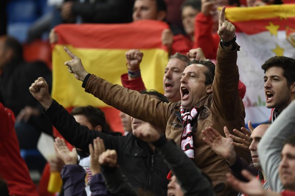 Spanish fans cheer for their team ahead of the UEFA Europa League final between England&#039;s Liverpool FC and Spain&#039;s Sevilla Futbol Club at the St. Jakob-Park stadium in Basel, Switzerland, on ...