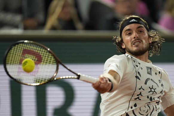 Greece&#039;s Stefanos Tsitsipas returns the ball to Italy&#039;s Lorenzo Musetti during their first round match of the French Open tennis tournament at the Roland Garros stadium Tuesday, May 24, 2022 ...