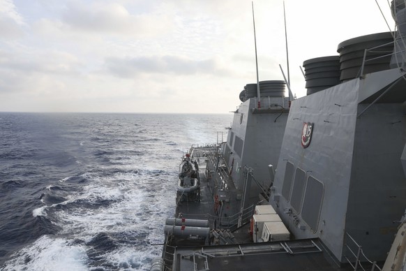 In this photo provided by the United States Navy, the Arleigh Burke-class guided-missile destroyer USS Milius (DDG 69) conducts routine operations in the South China Sea Friday, March 24, 2023. China three...