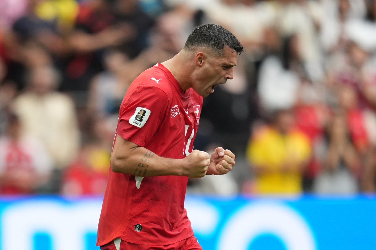 Switzerland's Granit Xhaka (10) reacts after scoring duringpenalty shootout during the World Cup round of 16 soccer match between Switzerland and Colombia in Vancouver, British Columbia, Tuesday, ...