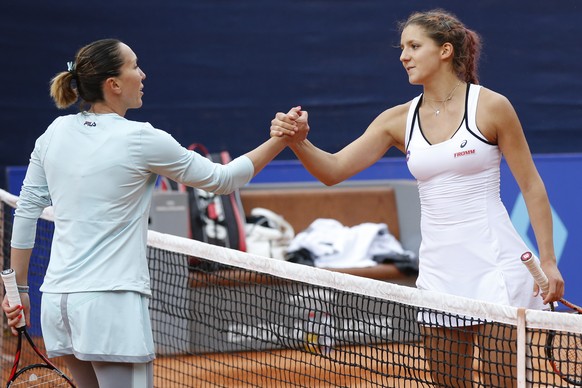 Rebeka Masarova of Switzerland, right, and Jelena Jankovic of Serbia shake hands after their first round match at the WTA Ladies Championship tennis tournament in Gstaad, Switzerland, Thursday, July 1 ...