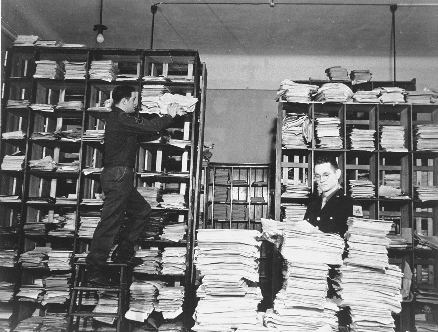 US Army staffers with some of the evidence of the Holocaust that they&#039;ve collected for the prosecution during the Nuremberg trials, c. 1946