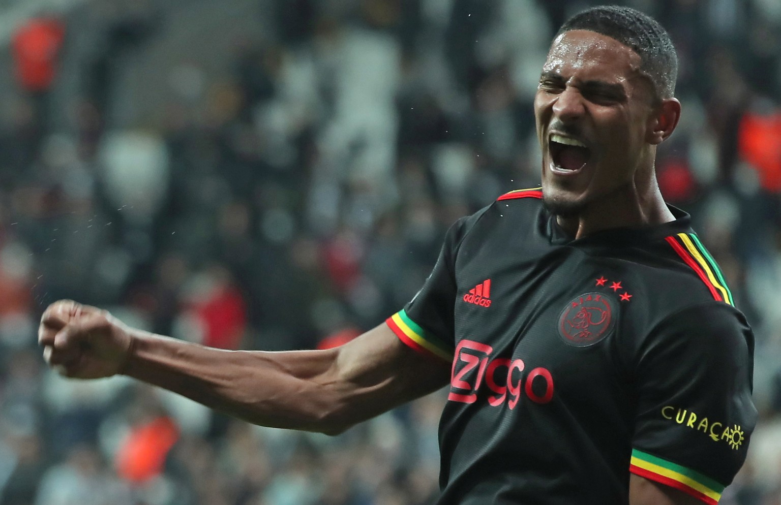 epa09601303 AFC Ajax player Sebastien Haller celebrates scoring the 2-1 lead during the UEFA Champions League Group C match between Besiktas and AFC Ajax in Istanbul, Turkey, 24 November 2021. EPA/ERD ...