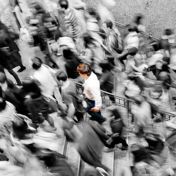 Rush hour - commuters in hectic fast paced urban staircase.