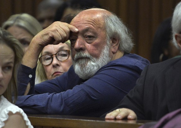 FILE ? Parents of the late Reeva Steenkamp, June, left, and Barry right, Steenkamp, right attend court on the third day of mitigation of sentencing for Olympic runner Oscar Pistorius at the high court ...