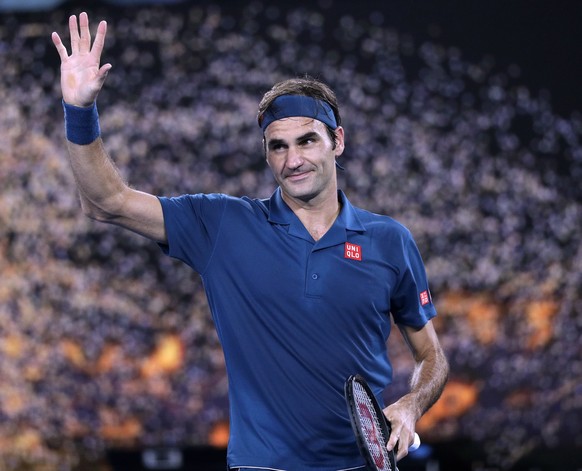 Switzerland&#039;s Roger Federer celebrates after defeating United States&#039; Taylor Fritz during their third round match at the Australian Open tennis championships in Melbourne, Australia, Friday, ...