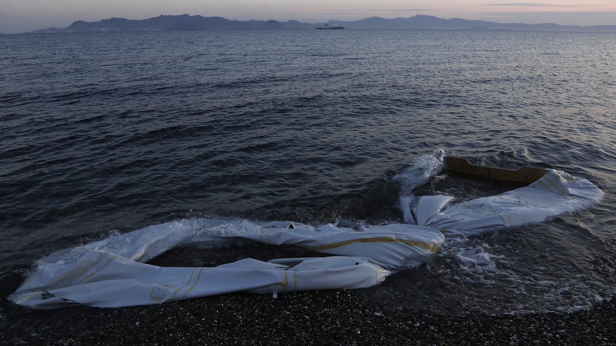 epa04754668 (30/30) Half sunk inflatable boats are washed ashore at the coast of Kos island, near the sea border with Turkey, Greece, 04 May 2015. The boats were used by refugees to disembark on the c ...