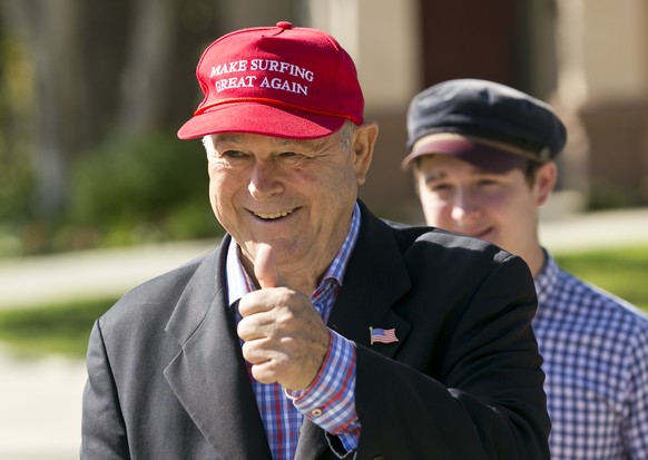 Rep. Dana Rohrabacher, left, with his son, Christian arrives to drop his ballot in Costa Mesa, Calif., Tuesday, Nov. 6, 2018. Rohrabacher is matched against Republican-turned-Democrat Harley Rouda in  ...