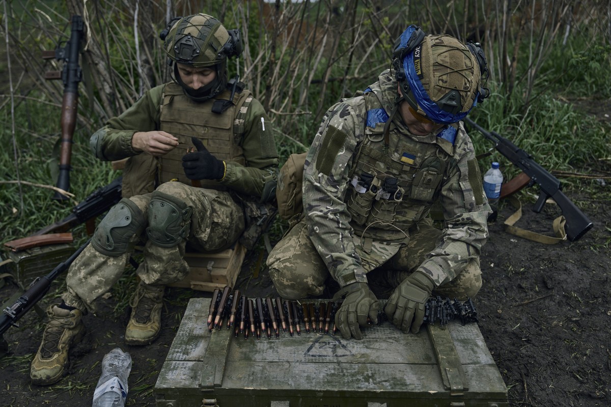 FILE - Ukrainian soldiers prepare their ammunition at the frontline positions near Vuhledar, Donetsk region, Ukraine, on May 1, 2023. Two years after Russia?s full-scale invasion captured nearly a qua ...