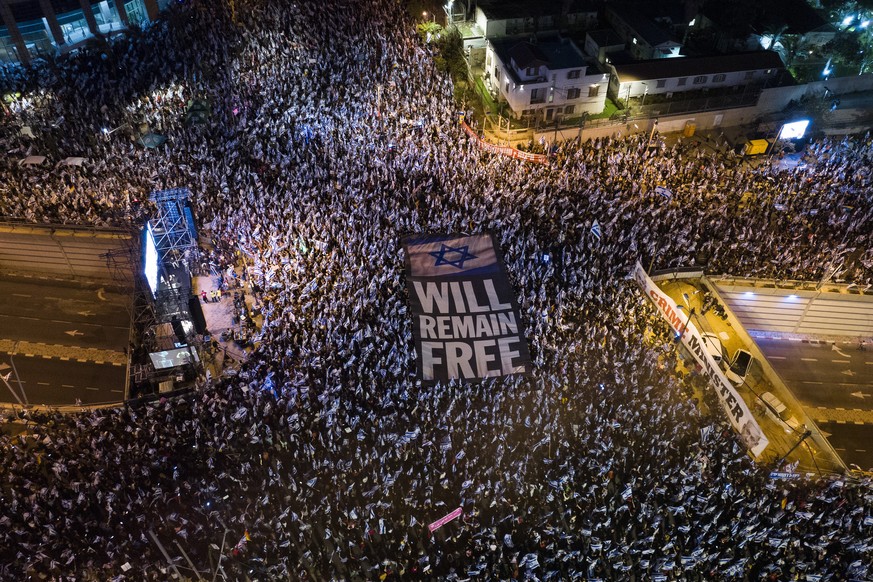 FILE - Tens of thousands of Israelis protest plans by Prime Minister Benjamin Netanyahu's government to overhaul the judicial system in Tel Aviv, Israel, Saturday, April 15, 2023.  Like Israel...