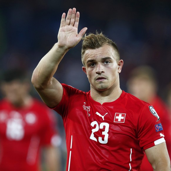 epa04551092 Swiss forward Xherdan Shaqiri waves to supporters as he leaves the pitch after the UEFA EURO 2016 qualifying soccer match between Switzerland and England at the St. Jakob-Park stadium in B ...