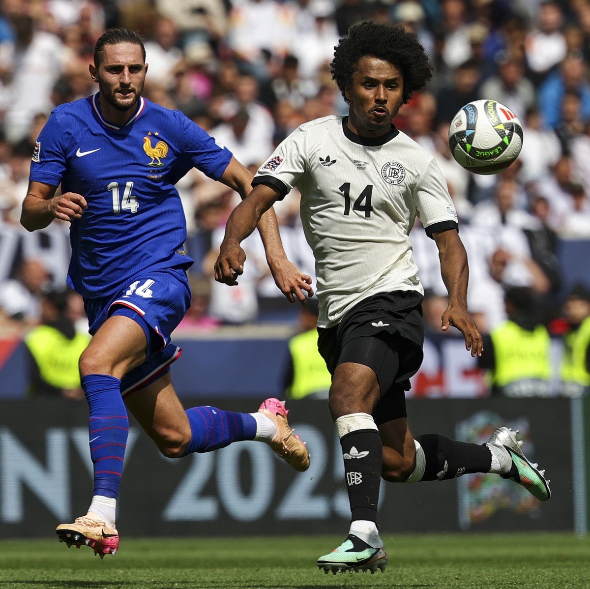 epa12164053 Adrien Rabiot of France (L) in action against Karim Adeyemi of Germany (R) during the UEFA Nations League 3rd place match between Germany and France in Stuttgart, Germany, 08 June 2025. EP ...