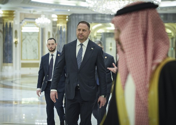 epa11955723 A handout photo made available by the Ukrainian Presidential Press Service shows the Head of the Presidential Office of Ukraine Andriy Yermak with delegation members arriving for a meeting ...
