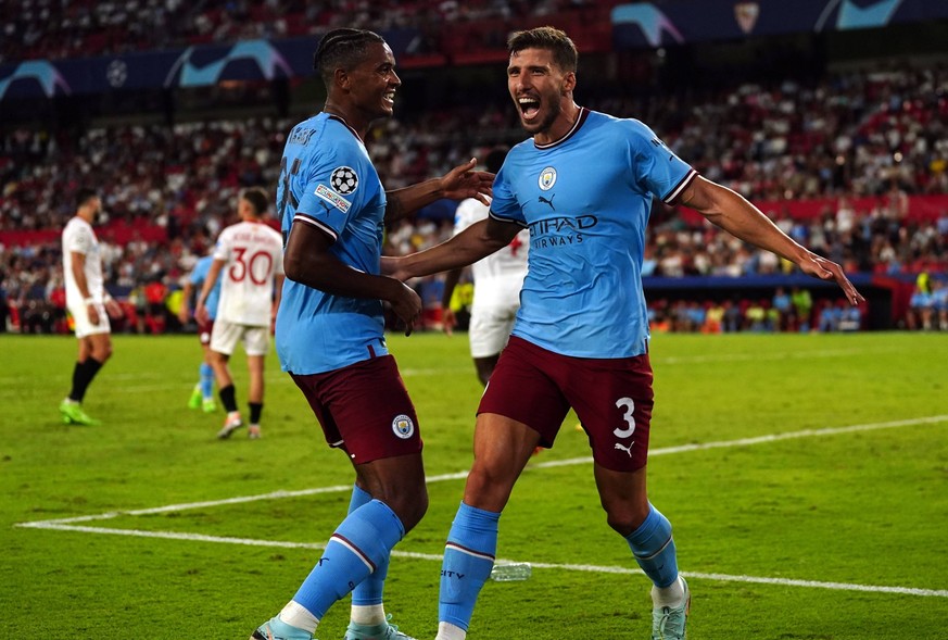 Sevilla v Manchester City - UEFA Champions League - Group G - Ramon Sanchez Pizjuan Stadium Manchester City s Ruben Dias right celebrates scoring their side s fourth goal of the game with team-mate Ma ...