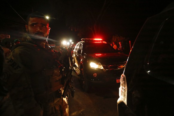 A Federal Police vehicle moves former lawmaker Roberto Jefferson after he was detained, from his house in Levy Gasparian, Rio de Janeiro state, Brazil, Sunday, Oct. 23, 2022. Jefferson, an ally of Bra ...