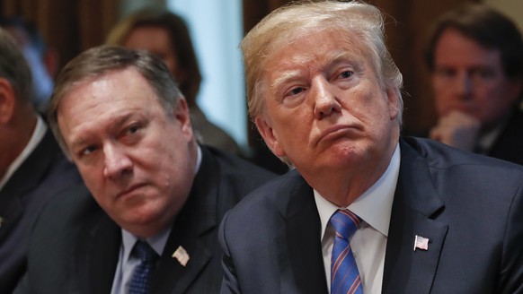 President Donald Trump, right, and Secretary of State Mike Pompeo, left, listen to Ivanka Trump, the daughter and assistant to President, speaks during his meeting with members of his cabinet in Cabin ...